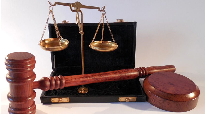 Legal Challenges showing a judges gavel and the scales of justice